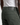 A person wearing PROJEK RAW’s BARU CLASSIC COLORED KNIT DENIM in olive green—a classic-fit, straight leg jean featuring a black leather patch with embossed text above the back pocket—paired with a white ribbed tank top.