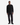 A man stands facing forward against a plain white background, wearing a black sweater, black shoes, and PROJEK RAW’s DREW BAGGY FIT DENIM in a black wash.
