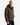 A man wearing a brown PROJEK RAW ECOFILL PUFFER JACKET with 4-way stretch and dark jeans stands facing forward with a neutral expression against a plain white background.