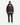 A man stands facing forward against a plain white background, wearing the PROJEK RAW TWILL BOMBER JACKET featuring a utility sleeve pocket, paired with a white T-shirt, dark green pants, and white sneakers.