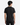 A person with short dark hair is standing and facing away from the camera, wearing a PROJEK RAW LUX ESSENTIAL JERSEY T-SHIRT paired with black pants against a white background—an urban essential look.