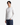 A man with medium-length black hair wears the PROJEK RAW RELAXED FIT HONEYCOMB CREWNECK SWEATER in white, paired with blue jeans and a silver chain necklace. He stands against a plain white background with one hand in his pocket.