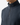 A person wearing the PROJEK RAW RELAXED FIT KNIT CORD PULLOVER SWEATER, a dark ribbed quarter-zip with a relaxed fit, ideal for casual streetwear. The zipper is half-closed, showing only the lower face and neck against a plain white background.