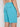 A person is shown from the waist down, wearing Projek Raws DEVIN-TURQUOISE shorts with an elastic waistband and zippered back pocket, standing against a plain light background.
