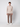 A man stands against a plain light background wearing the PROJEK RAW Mens Half-zip Cashmere Touch Sweater in beige, paired with brown pants and white sneakers, facing forward with his arms relaxed at his sides.
