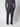 A person is seen from the back wearing PROJEK RAW Mens Bungee Loose Cargo Pant in dark gray with side pockets, paired with a matching long-sleeve shirt and white sneakers, set against a light background.