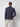 A man faces away from the camera, wearing a PROJEK RAW Mens Long Sleeve Turtleneck Sweater with light-colored pants against a plain light background.