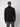 A man with short brown hair faces away from the camera, wearing a PROJEK RAW Mens Long Sleeve Turtleneck Sweater and dark gray pants against a plain light background.