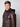 A young man with short light brown hair wears a PROJEK RAW Mens Vegan Leather Moto Jacket with Removable Hood, featuring front pockets and a black hood. He faces the camera neutrally against a plain light background.
