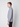 A man with short light brown hair, in profile facing left, models the PROJEK RAW Mens Half-zip Cashmere Touch Sweater in light grey and black pants against a plain white background.