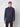A young man faces forward, wearing a PROJEK RAW Mens Half-zip Cashmere Touch Sweater in dark gray and black pants against a plain light gray background.