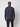 A man faces away from the camera, wearing a PROJEK RAW Mens Half-zip Cashmere Touch Sweater in dark gray and dark pants, set against a plain white background.