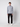A young man faces forward in a PROJEK RAW Mens Long Sleeve Full Zip Mock Neck Sweater, paired with black pants and white sneakers, set against a plain white background.