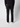 A person stands facing away, showcasing the back of PROJEK RAW Mens 5-Pocket Flex Knit Jeans, styled with a black sweater and white sneakers against a plain light background.